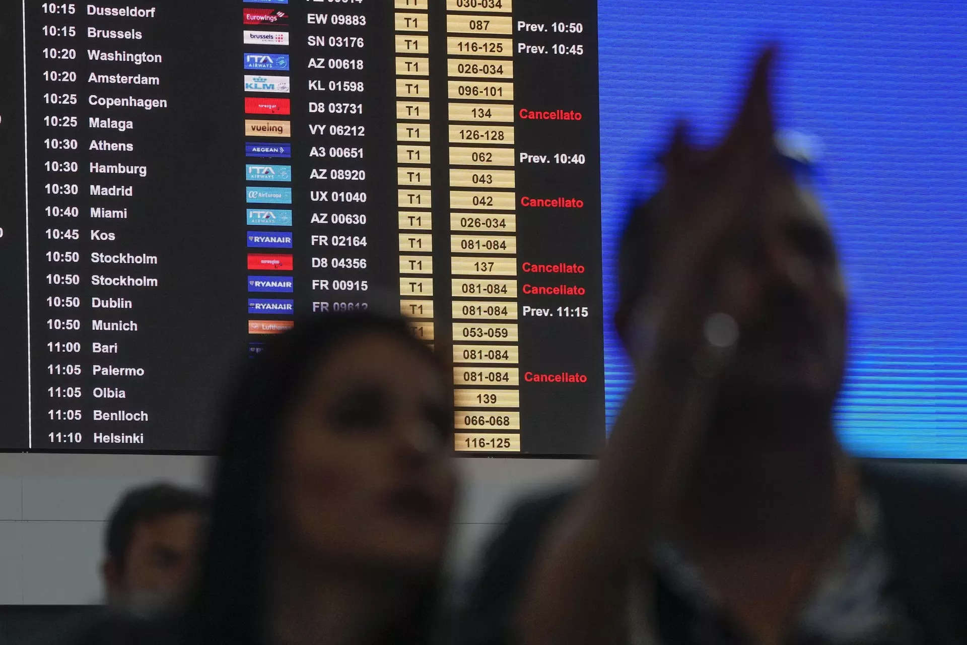 <p>Passengers look at a monitor with the departure times of flights during a nationwide strike of airports ground staff, and check-in services at Rome's Fiumicino International airport in Fumicino, Italy, Saturday, July 15, 2023. (AP Photo/Gregorio Borgia)</p>
