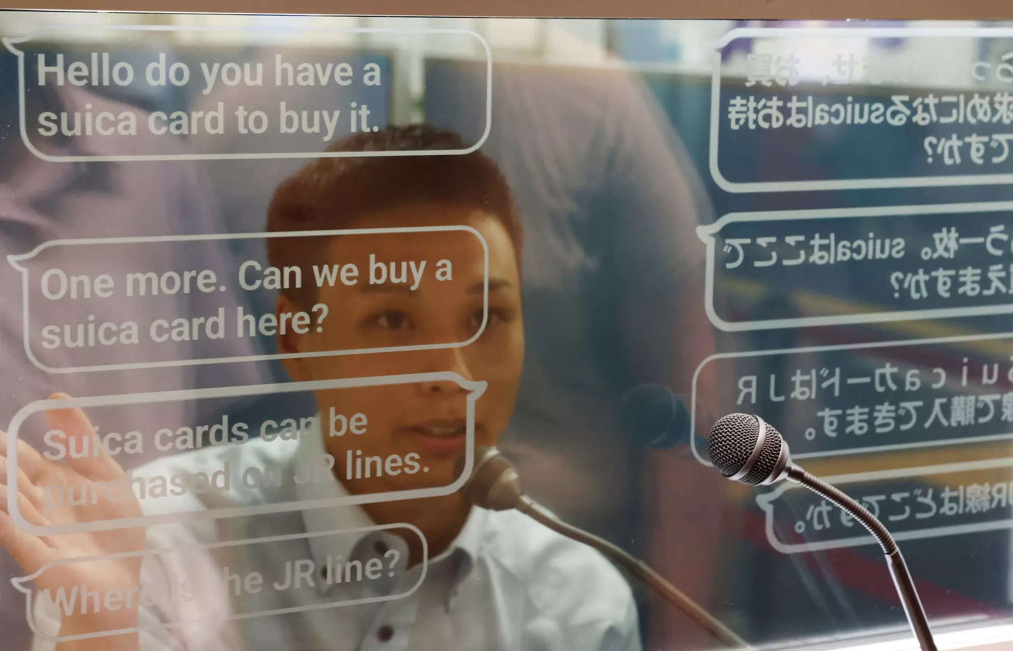 <p>A staff of Seibu Railway uses an automated translation window to communicate with Austrian tourist Georg Riedlbaur (not in the picture) at the Seibu-Shinjuku station in Tokyo, Japan, July 26, 2023. REUTERS/Kim Kyung-Hoon/File photo</p>