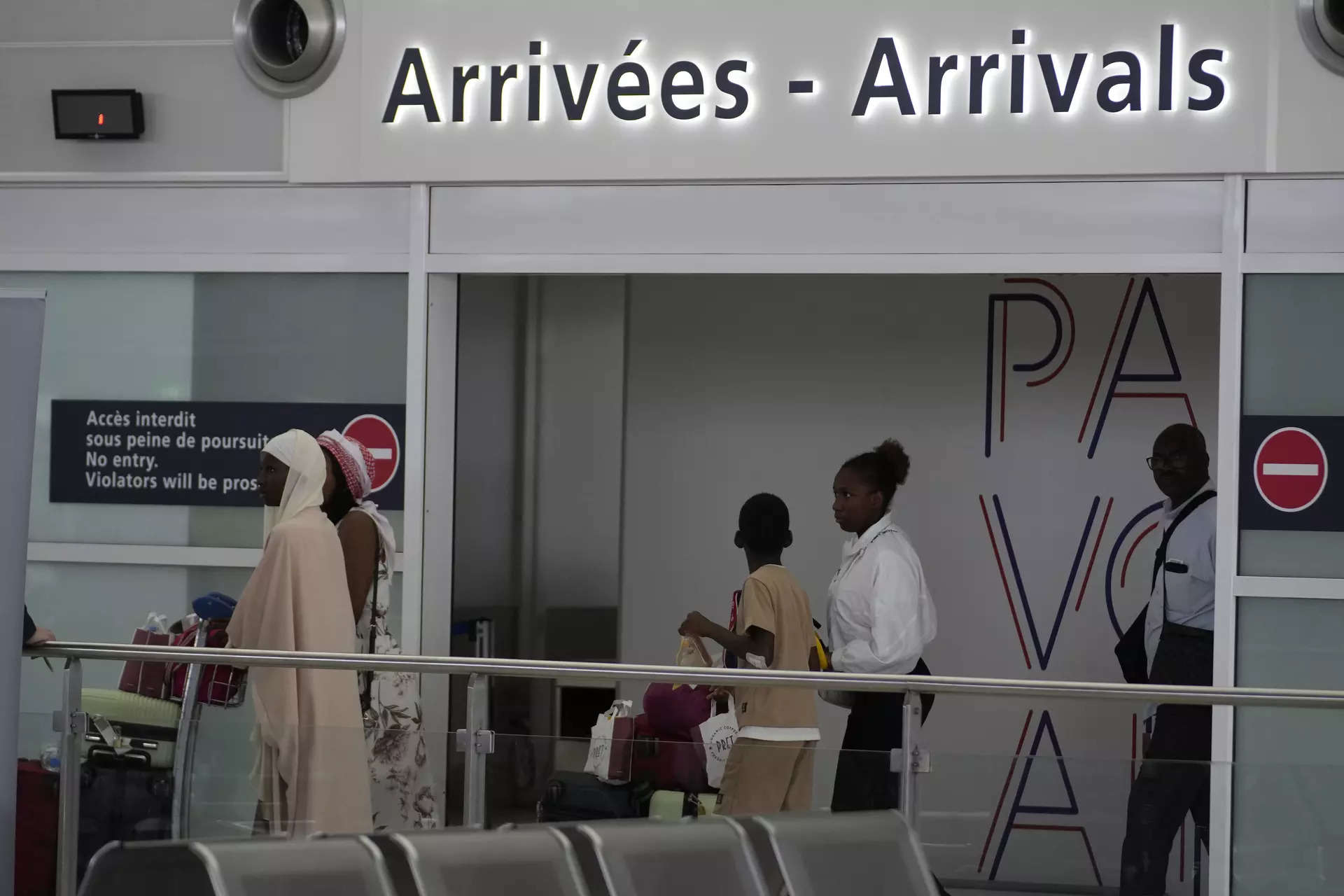 <p>People arrive after being evacuated from Niger at the Roissy Charles de Gaulle airport, north of Paris, France, Wednesday, Aug. 2, 2023.</p>