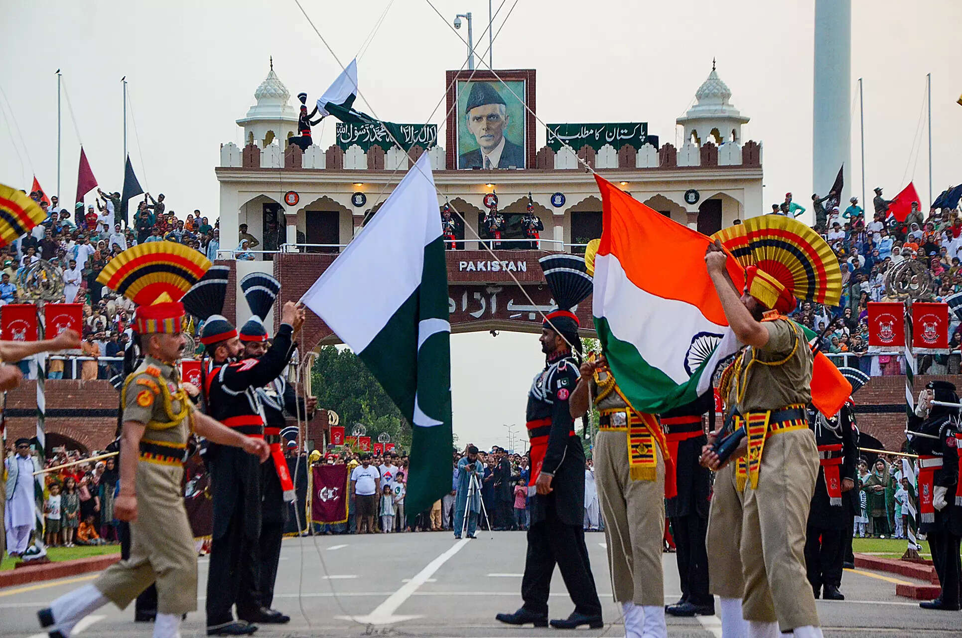 <p>Attari: Border Security Force (BSF) and Pakistani Rangers personnel during the celebrations of the India's 77th Independence Day, at the Attari-Wagah border. (PTI Photo)   (</p>