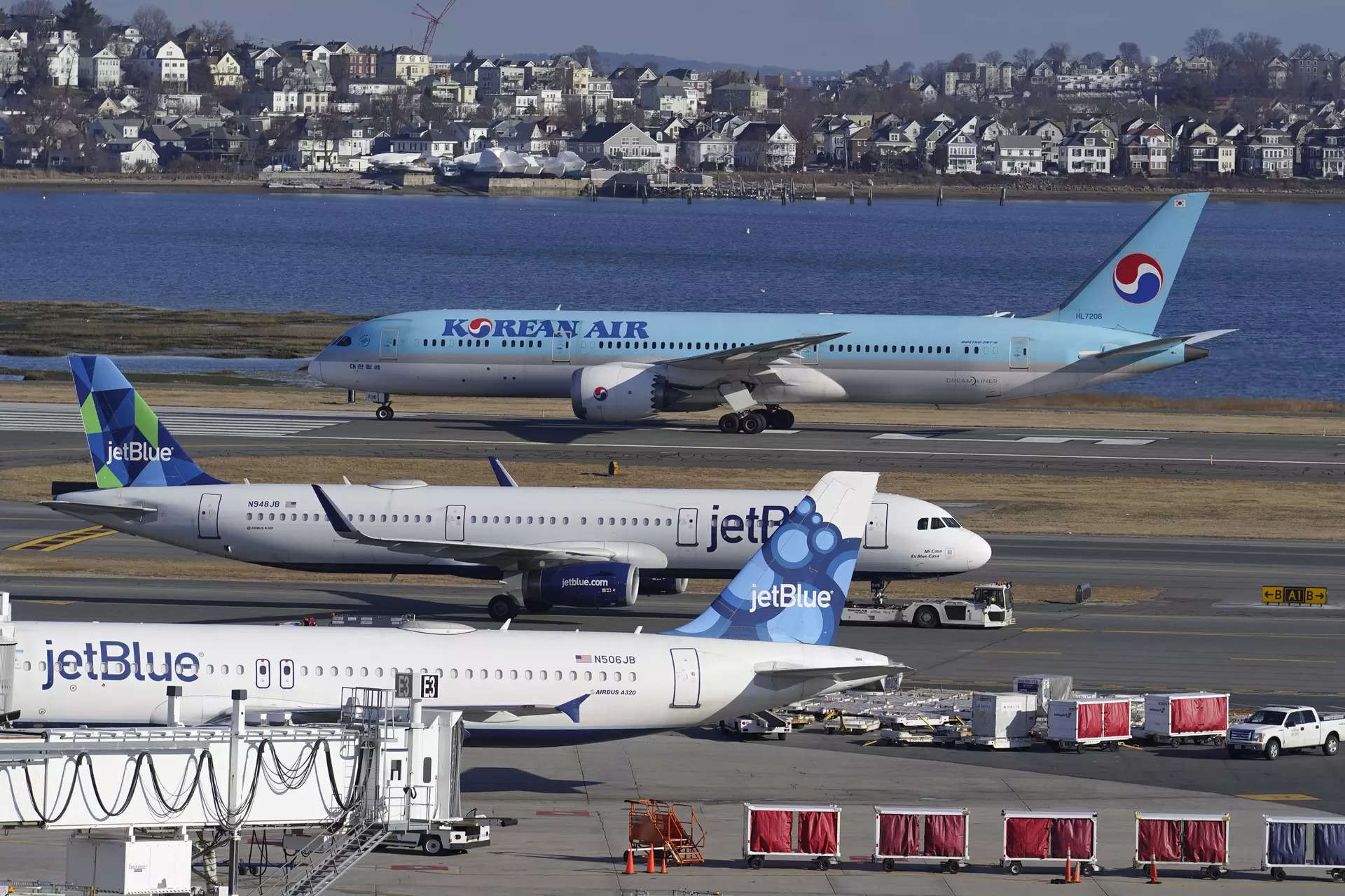 <p>Passenger jets are seen on the tarmac at Logan International Airport, Jan. 11, 2023, in Boston.</p>