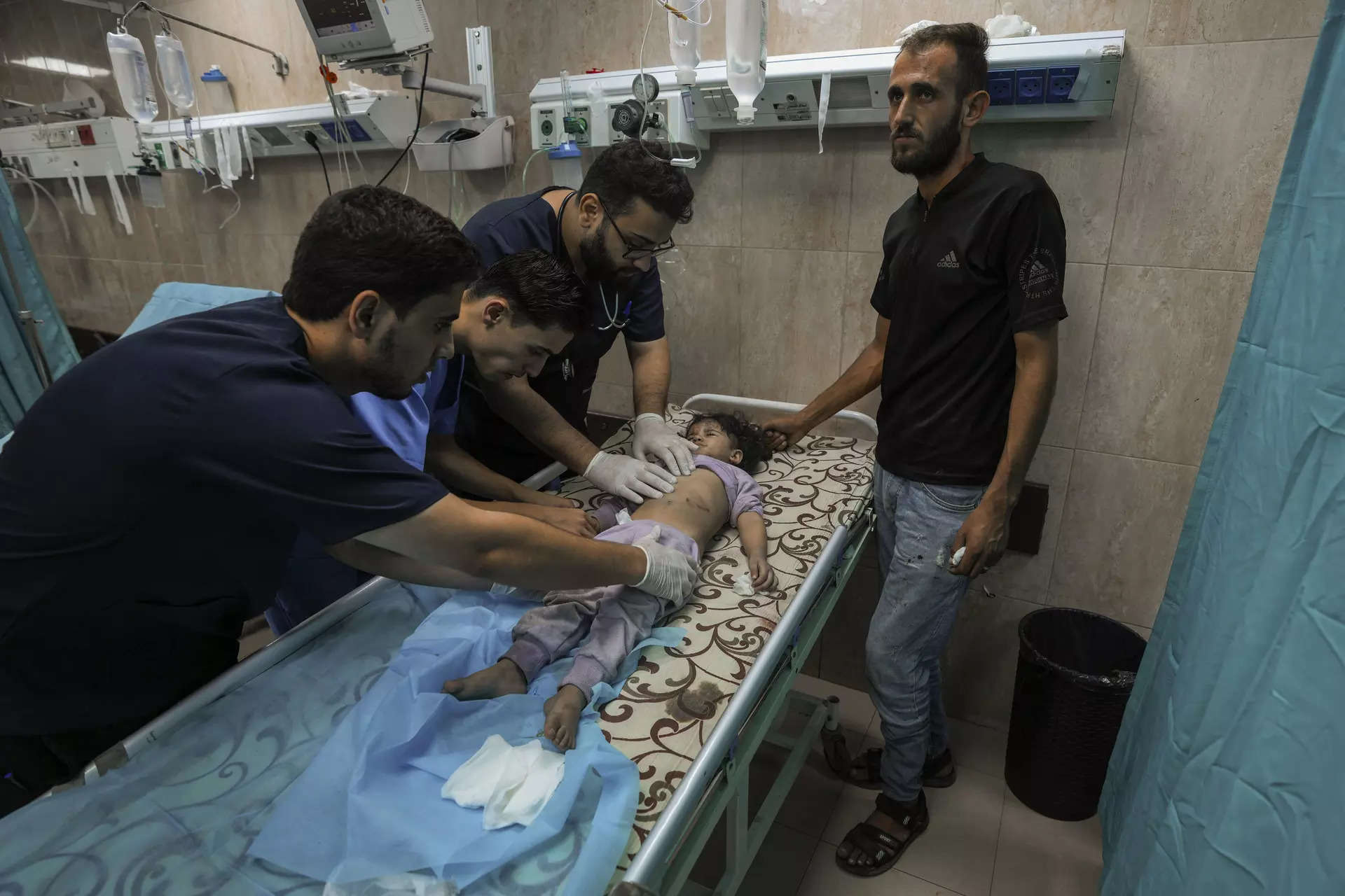 <p>A Palestinian child wounded during an Israeli airstrike receives medical treatment at al-Aqsa hospital in Deir el-Balah, central Gaza Strip, Sunday, Oct. 15, 2023. (AP Photo/Adel Hana)</p>