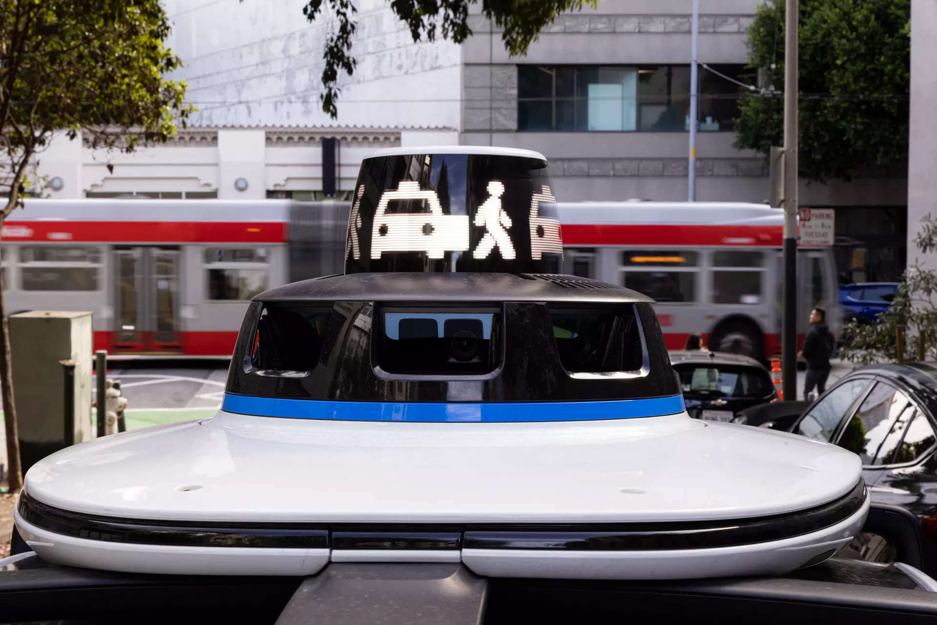 <p>A Waymo autonomous vehicle signals a drop-off on Brady Street in San Francisco, on November 17, 2023.</p>