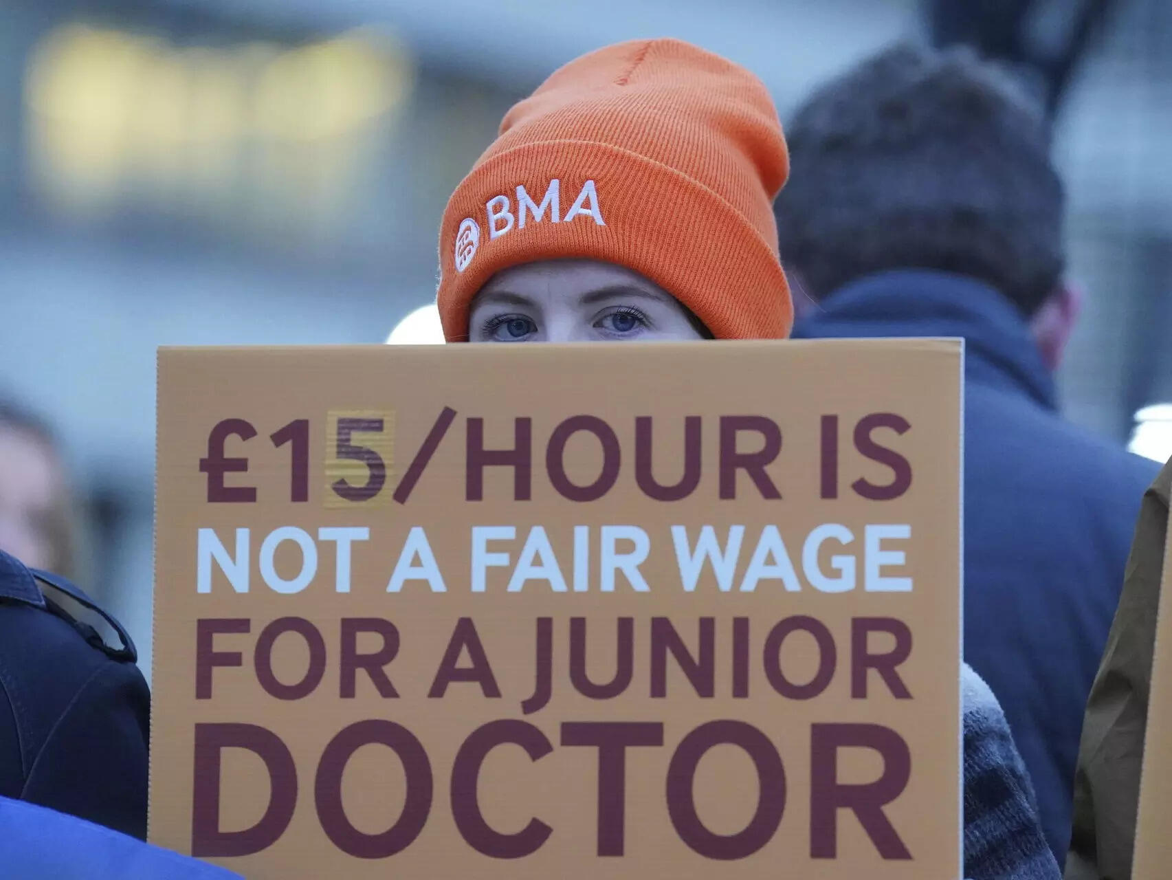 <p>Junior doctors and members of the British Medical Association (BMA) demonstrate outside St Thomas' Hospital, London, Wednesday, Jan. 3, 2024, as they take to picket lines for six days. Doctors in the early stages of their careers in England have started a 72-hour strike in their long-running dispute over pay levels. (Jonathan Brady/PA via AP)</p>