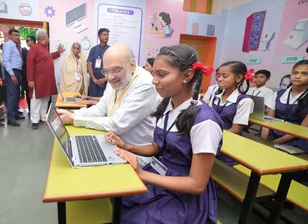 <p>Union Home Minister Amit Shah interacts with school children during inauguration of various development works of Ahmedabad Municipal Corporation (AMC) in Ahmedabad on Monday.</p>
