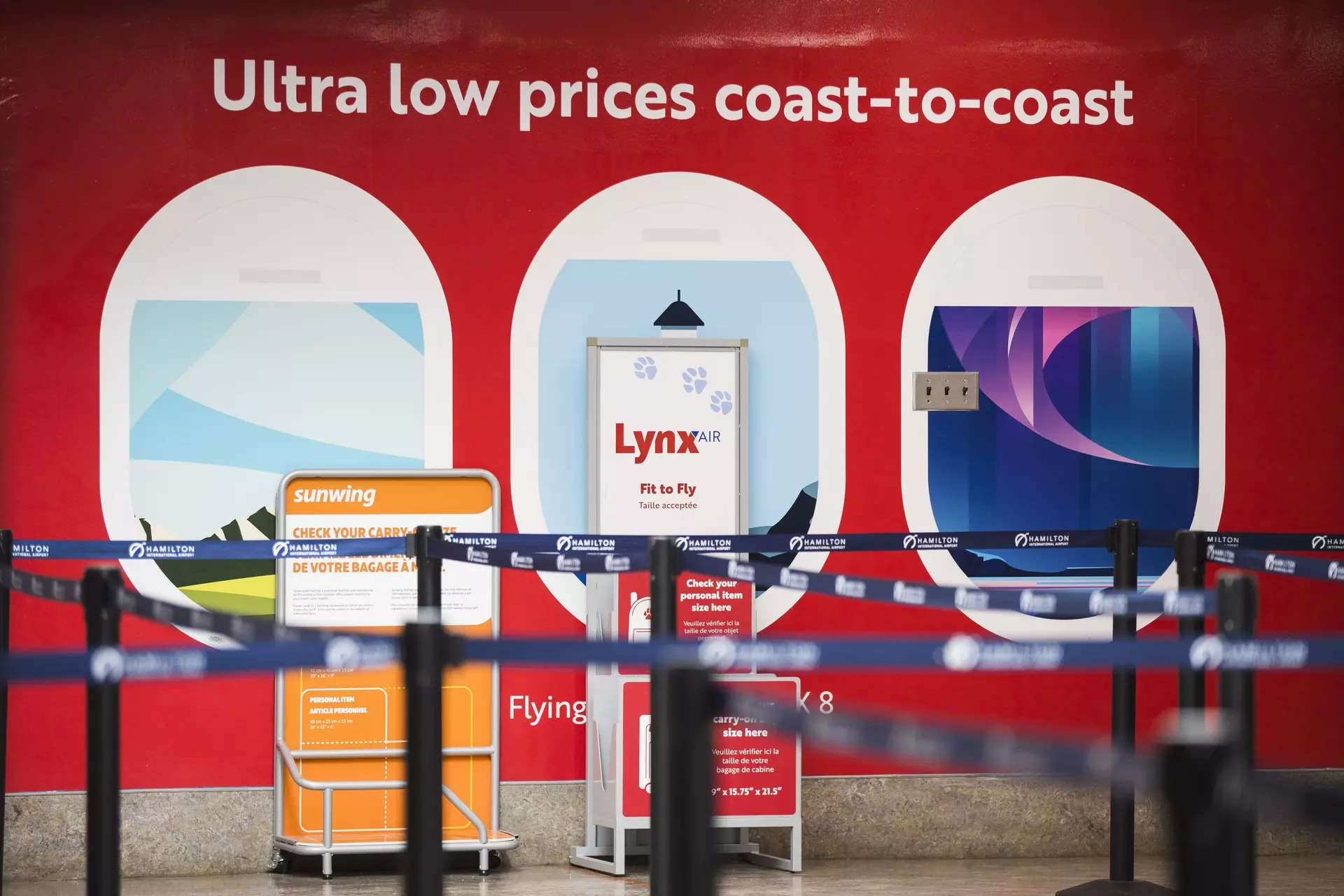 <p>Lynx Air signage is displayed at the John C. Munro Hamilton International Airport in Hamilton, Ontario, Friday, Feb. 23, 2024. Officials with the Calgary-based company announced that it is ceasing operations after filing for creditor protection. (Nick Iwanyshyn/The Canadian Press via AP)</p>
