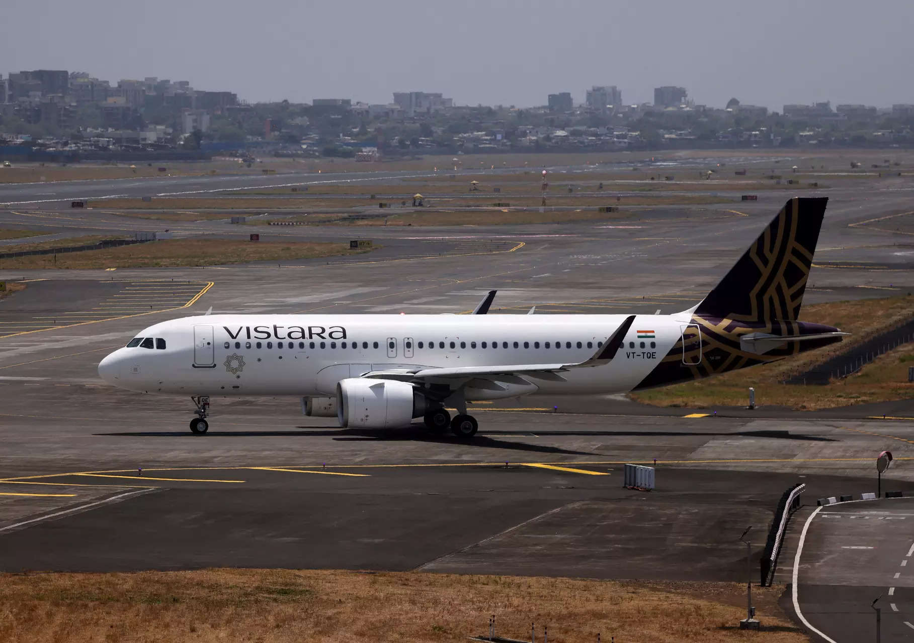 <p>A Vistara passenger aircraft on the tarmac at Chhatrapati Shivaji International Airport.</p>