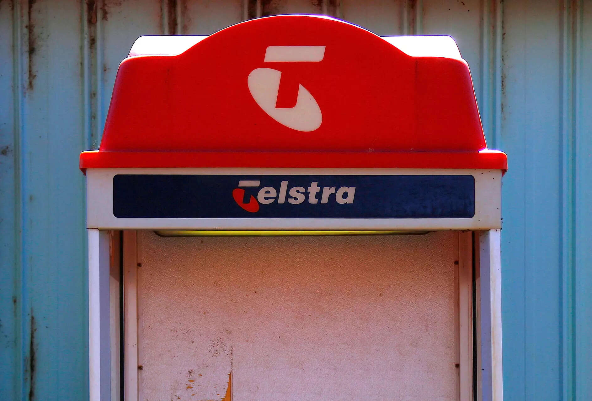 

<p>FILE PHOTO: A public telephone booth bearing the logo of Telstra Corp Ltd, Australia's largest telecommunications company, stands outside the Cooladdi post office and motel, located in the town of Cooladdi in south-west Queensland, Australia, August 14, 2017. REUTERS /David Gray/File Photo</p>
<p>“/><figcaption class=