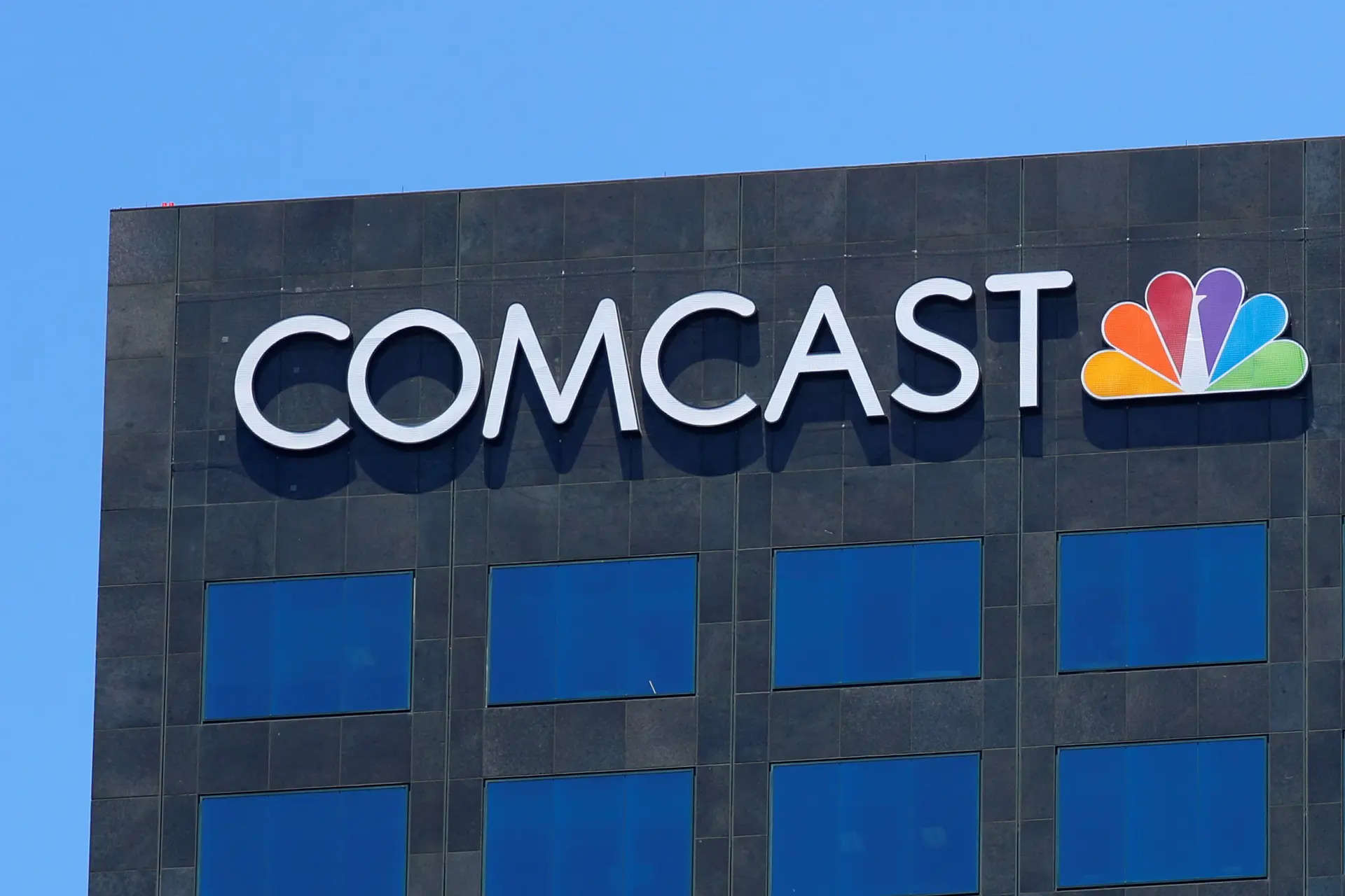 FILE PHOTO: The Comcast NBC logo is shown on a building in Los Angeles, California, U.S. June 13, 2018. REUTERS/Mike Blake/File Photo</p>