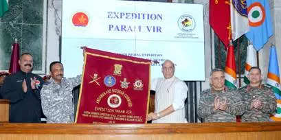 <p>Defence minister Rajnath Singh receives the expedition flag from the team at the flag-in ceremony in New Delhi on Friday.</p>