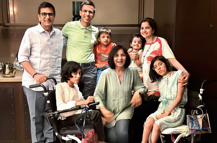 <p>Justice DY Chandrachud and (centre) wife Kalpana Das with foster care daughters Priyanka and Mahi. (Back row) Son Abhinav, grandchildren Uday and Radha, and daughter-in-law Aparna</p>