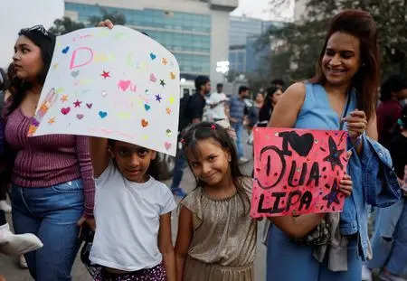 <p>FILE PHOTO: Girls hold posters outside the venue of the Dua Lipa concert in Mumbai, India November 30, 2024. REUTERS/Francis Mascarenhas/File Photo</p>