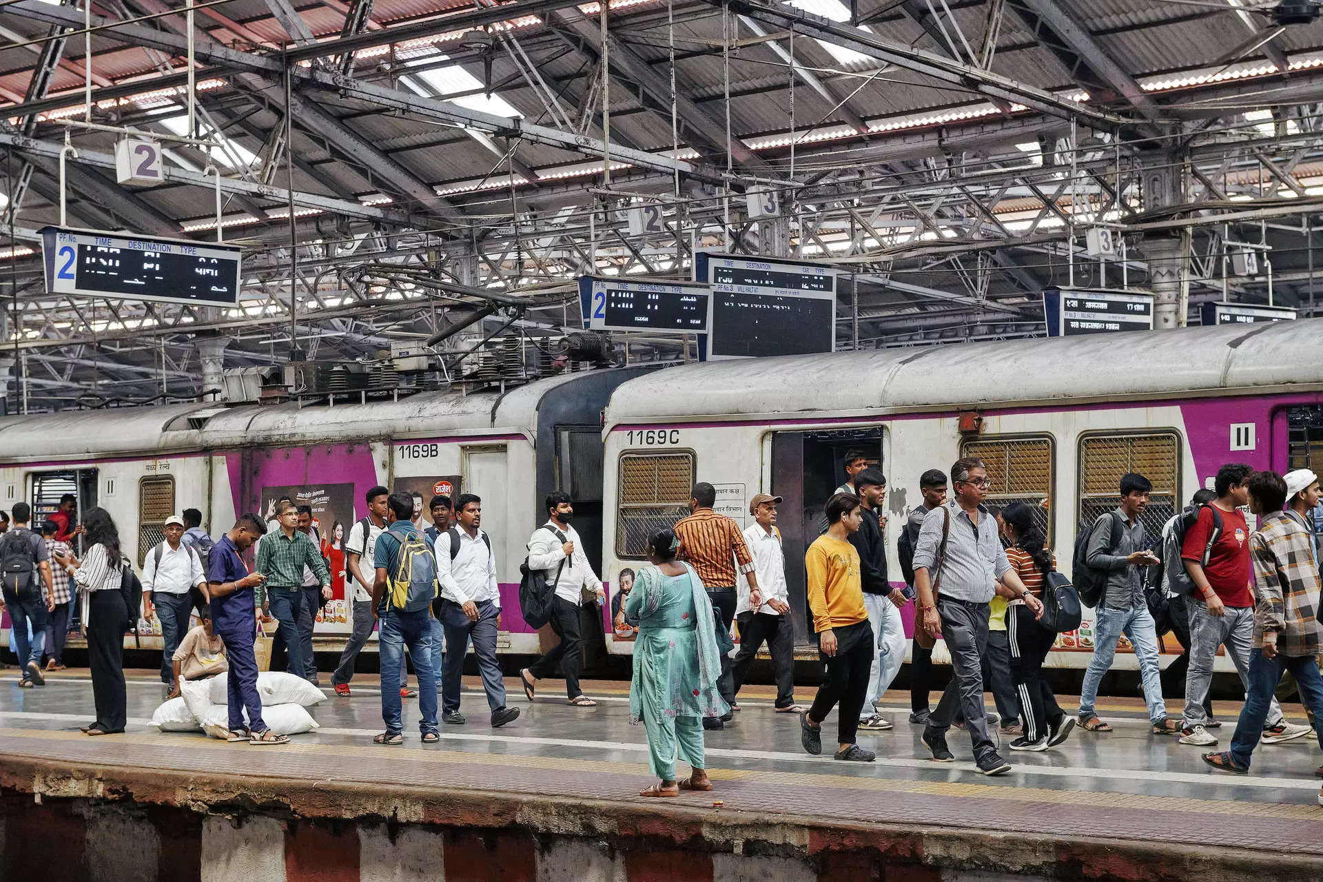 <p>Commuters at a railway station in Mumbai, India, Oct. 8, 2024.  (Poras Chaudhary/The New York Times)</p>