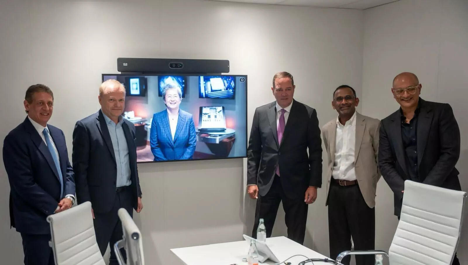 <p>From L to R: Phil Guido, EVP and Chief Commercial Officer at AMD, Pekka Lundmark, President and CEO at Nokia, Lisa Su (on screen), Chair and CEO, AMD, Chuck Robbins, Chair and CEO, Cisco, Mathew Oommen, Group CEO, Reliance Jio, Jeetu Patel, EVP & Chief Product Officer - Cisco, at the unveiling plan for Open Telecom AI Platform at MWC 2025.</p>