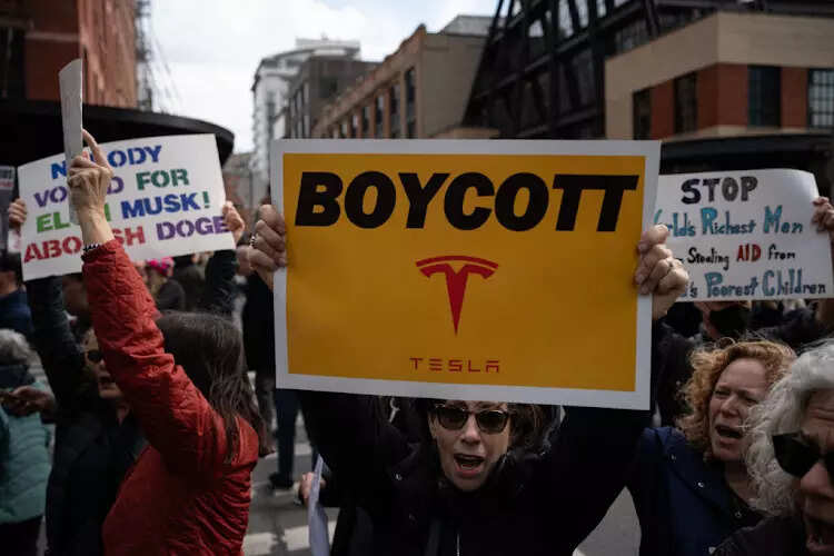 <p>The 'Tesla Takedown' movement is gaining momentum as activists protest against Tesla and Elon Musk in response to federal job cuts linked to Musk's role in the Department of Government Efficiency.</p>