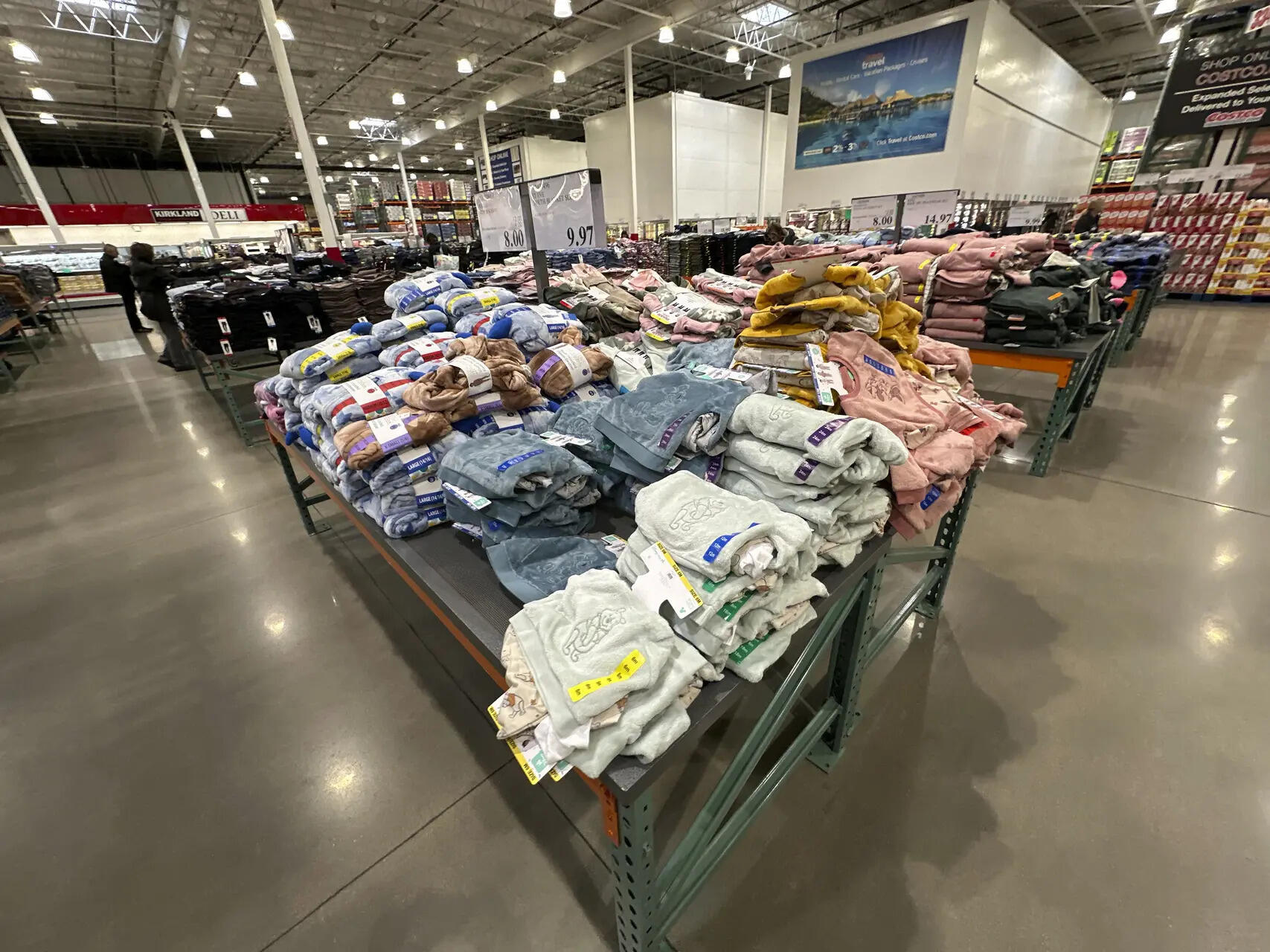 <p>FILE - Children's clothing sits stacked on a table for shoppers in a Costco warehouse Thursday, Jan. 23, 2025, in Sheridan, Colo. (AP Photo/David Zalubowski, File)</p>