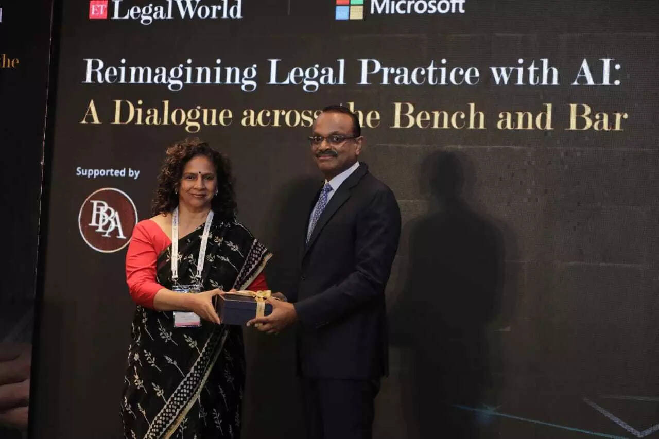 SEBI's Whole Time Director being felicitated by Jyoti Pawar, Global GC with Microsoft CELA
