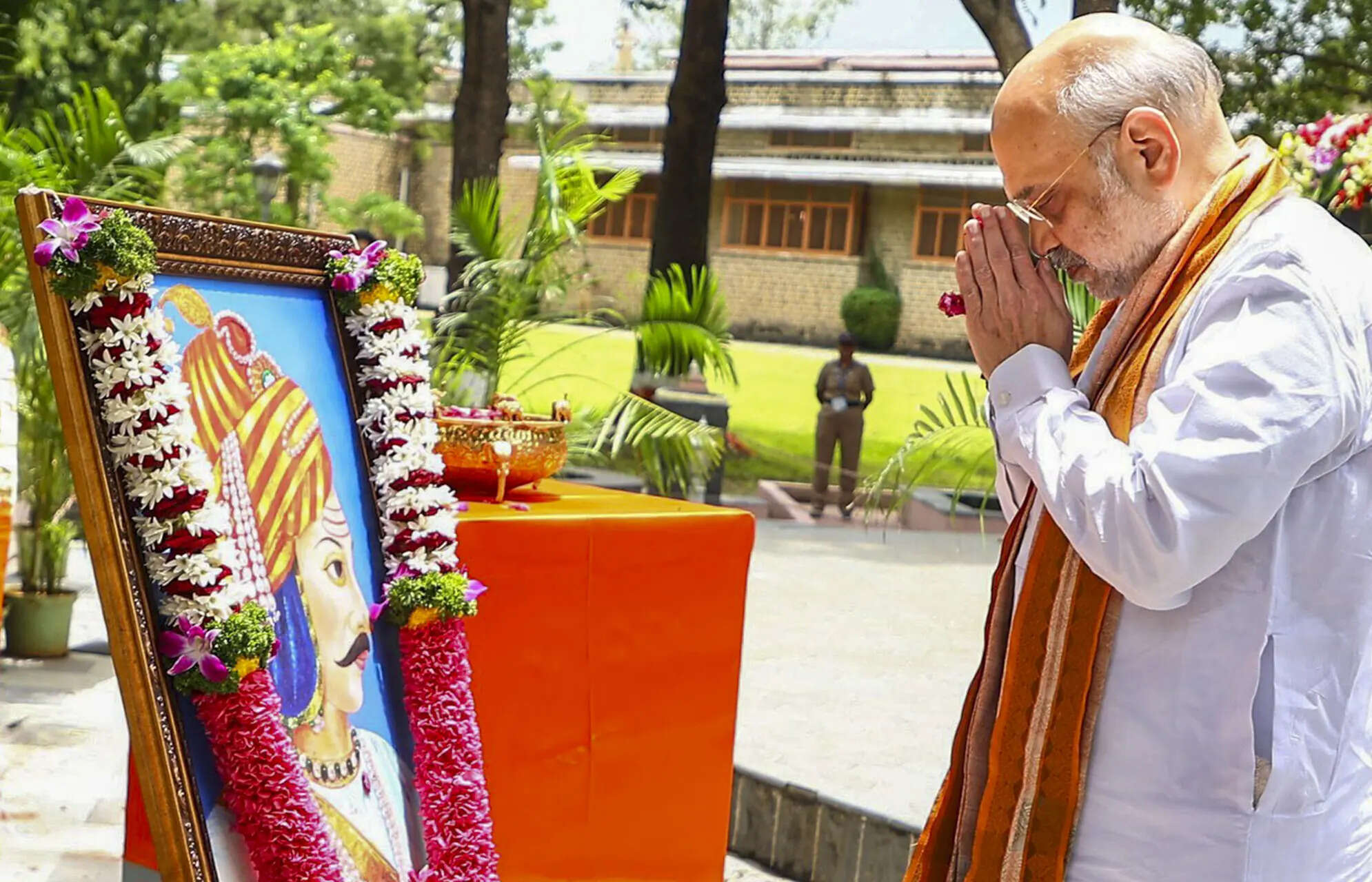**EDS: THIRD PARTY IMAGE** In this image posted by @mieknathshinde via X on July 4, 2025, Union Home Minister Amit Shah pays tribute to Peshwa Bajirao during the unveiling of the latter's statue, in Pune. (@mieknathshinde on X via PTI Photo) (PTI07_04_2025_000267B)