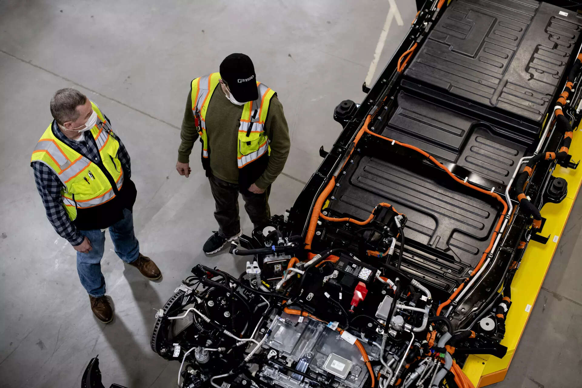 FILE -- An overhead view of the 2022 Ford F-150 Lightning's chassis, including its engine and batteries, at the automaker's plant in Dearborn, Mich., Jan. 25, 2022. Ford Motor said on Wednesday, July 9, 2025, that a plant it was building to make batteries for its electric vehicles, like the F-150 Lightning, would still qualify for federal tax credits after a last-minute tweak to the policy bill passed by Congress last week. (Brittany Greeson/The New York Times)