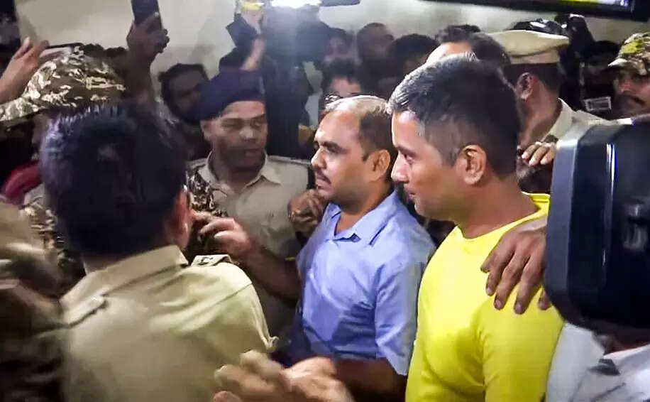 Former Chhattisgarh Chief Minister and Congress leader Bhupesh Baghel's son, Chaitanya Baghel, being produced by the Enforcement Directorate (ED) at PMLA court, in Raipur on Friday. (ANI Video Grab)