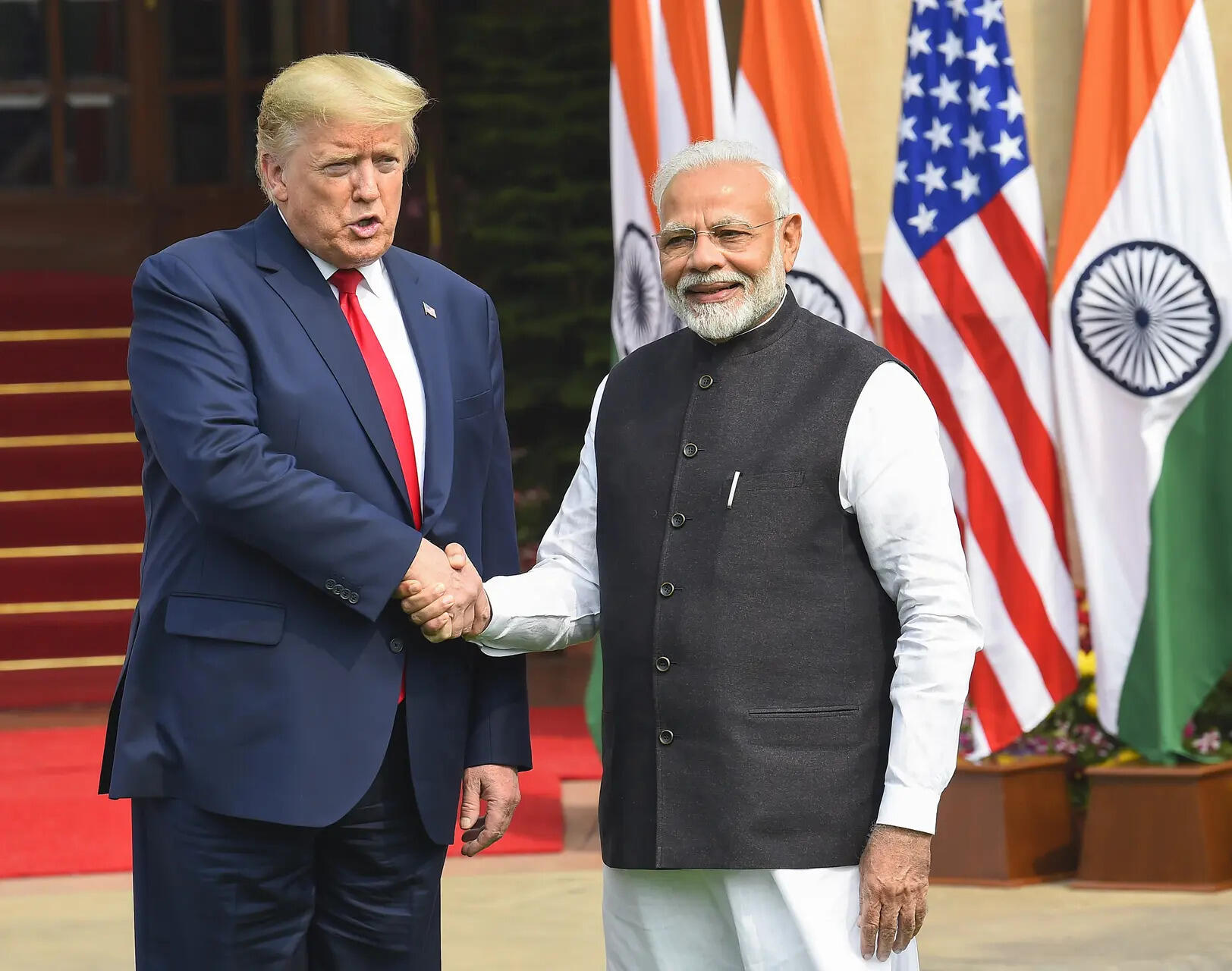 <p>In this Feb. 25, 2020 file photo, Prime Minister Narendra Modi with US President Donald Trump at Hyderabad House, in New Delhi. US President Donald Trump on Wednesday, July 30, 2025 announced the imposition of a 25 per cent tariff on all goods coming from India starting August 1, plus an unspecified penalty for buying military equipment and crude oil from Russia. </p>