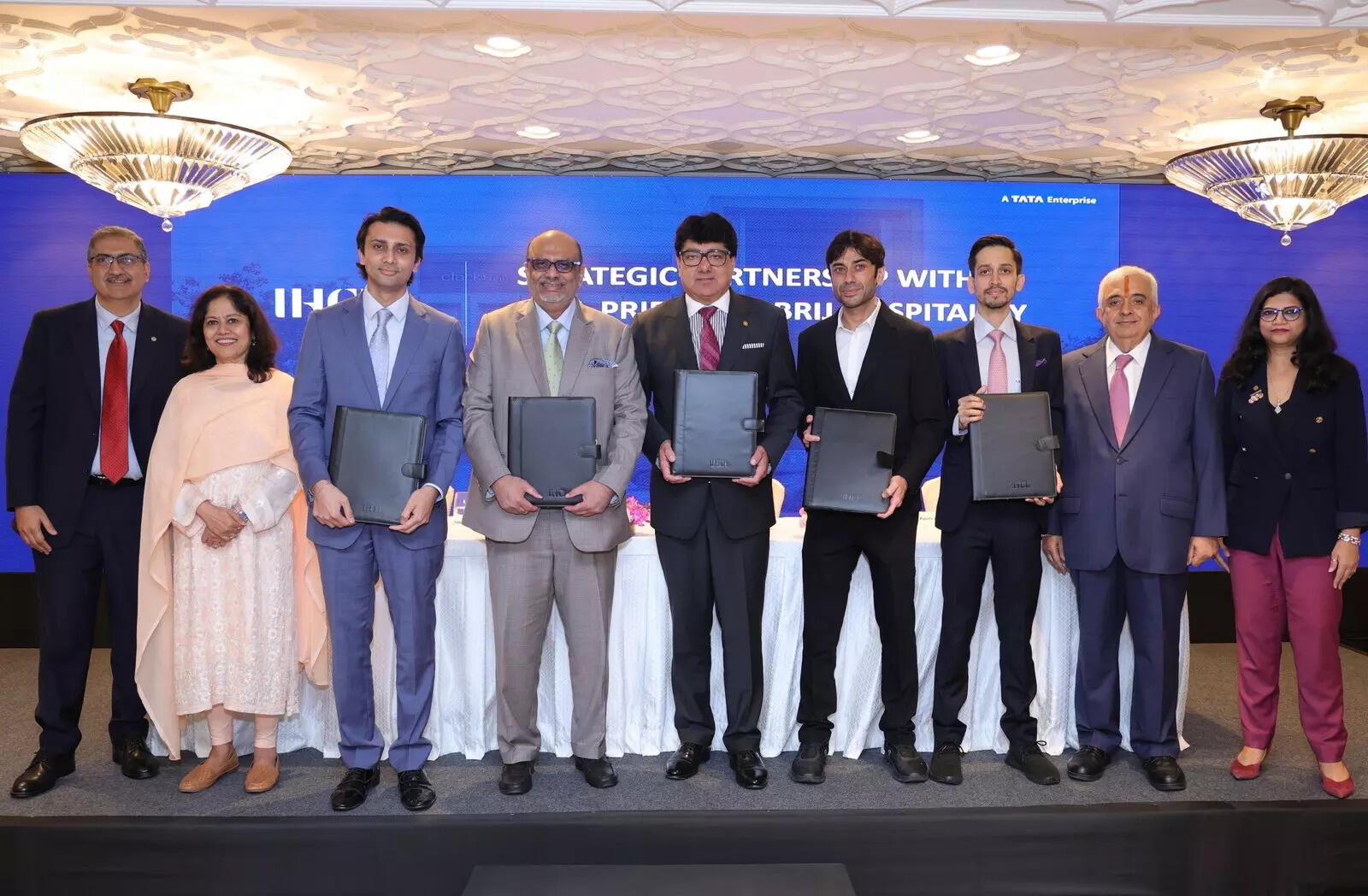 <p>Puneet Chhatwal (fifth from left), managing director & chief executive officer, IHCL with other stakeholders at a press conference announcing  a strategic partnership, signing definitive agreements to acquire controlling stake in ANK Hotels Pvt Ltd and Pride Hospitality Pvt Ltd and signed a distribution agreement with Brij Hospitality Pvt Ltd. </p>