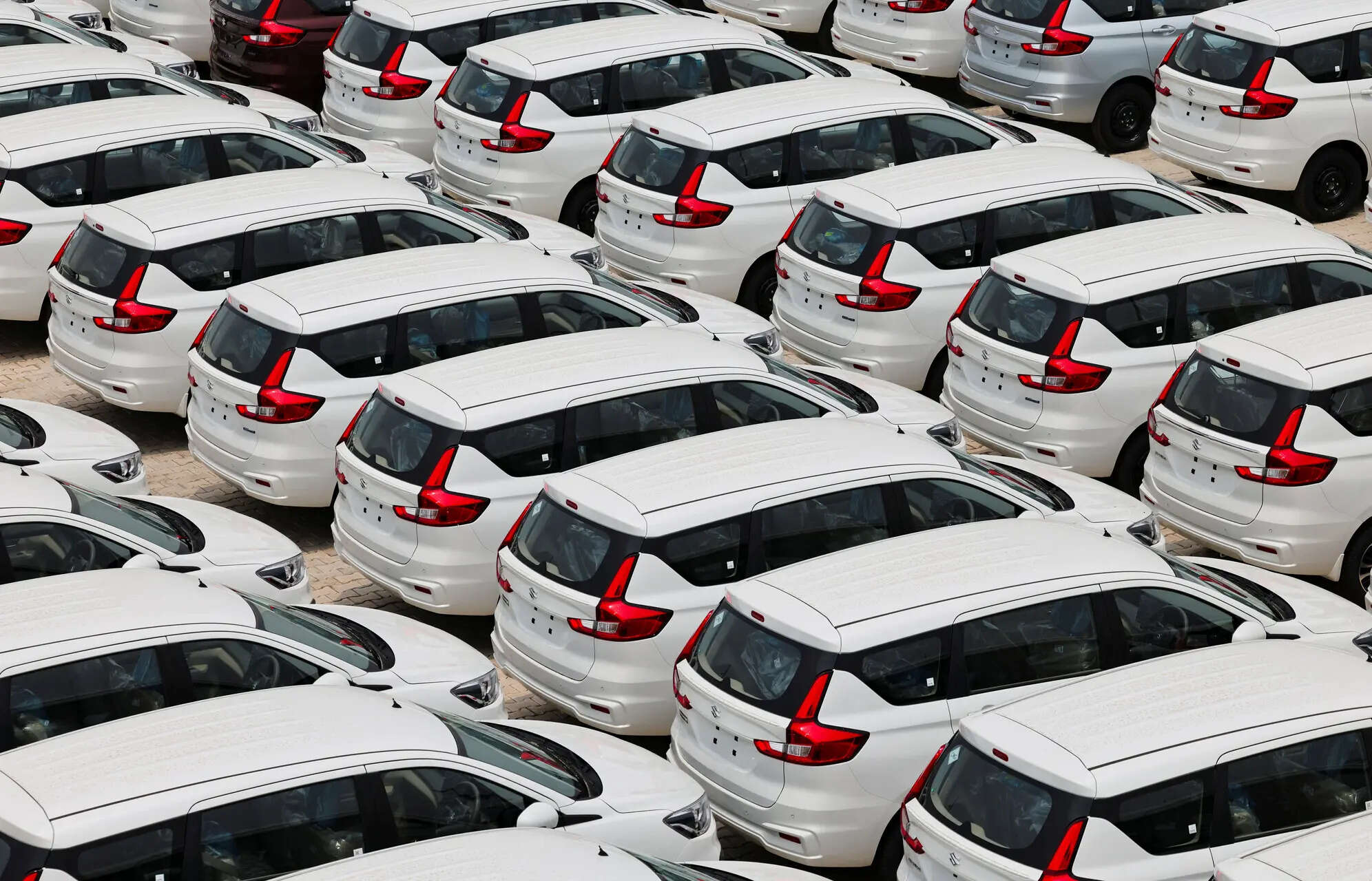 <p>FILE PHOTO: Maruti Suzuki Ertiga cars are parked at Maruti Suzuki's plant in Manesar, Haryana, India, June 17, 2025. </p>