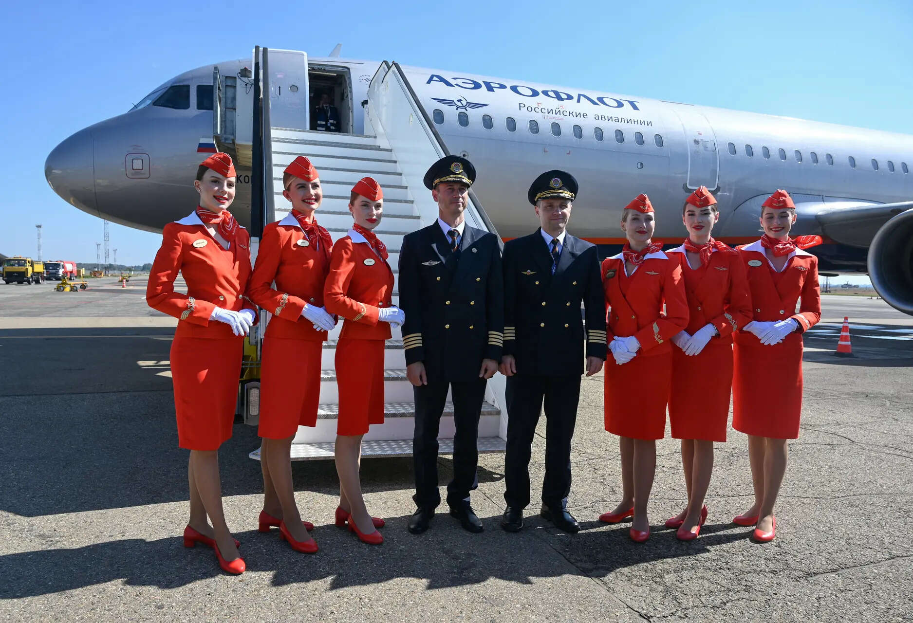 <p>Сrew members of an Aeroflot airline's plane operating a flight from the city of Moscow pose for a picture during a ceremony, which marks the arrival of the first aircraft and the reopening of a local airport since flights were suspended in 2022 due to security concerns amid the Russia-Ukraine military conflict, in Krasnodar, Russia, </p>