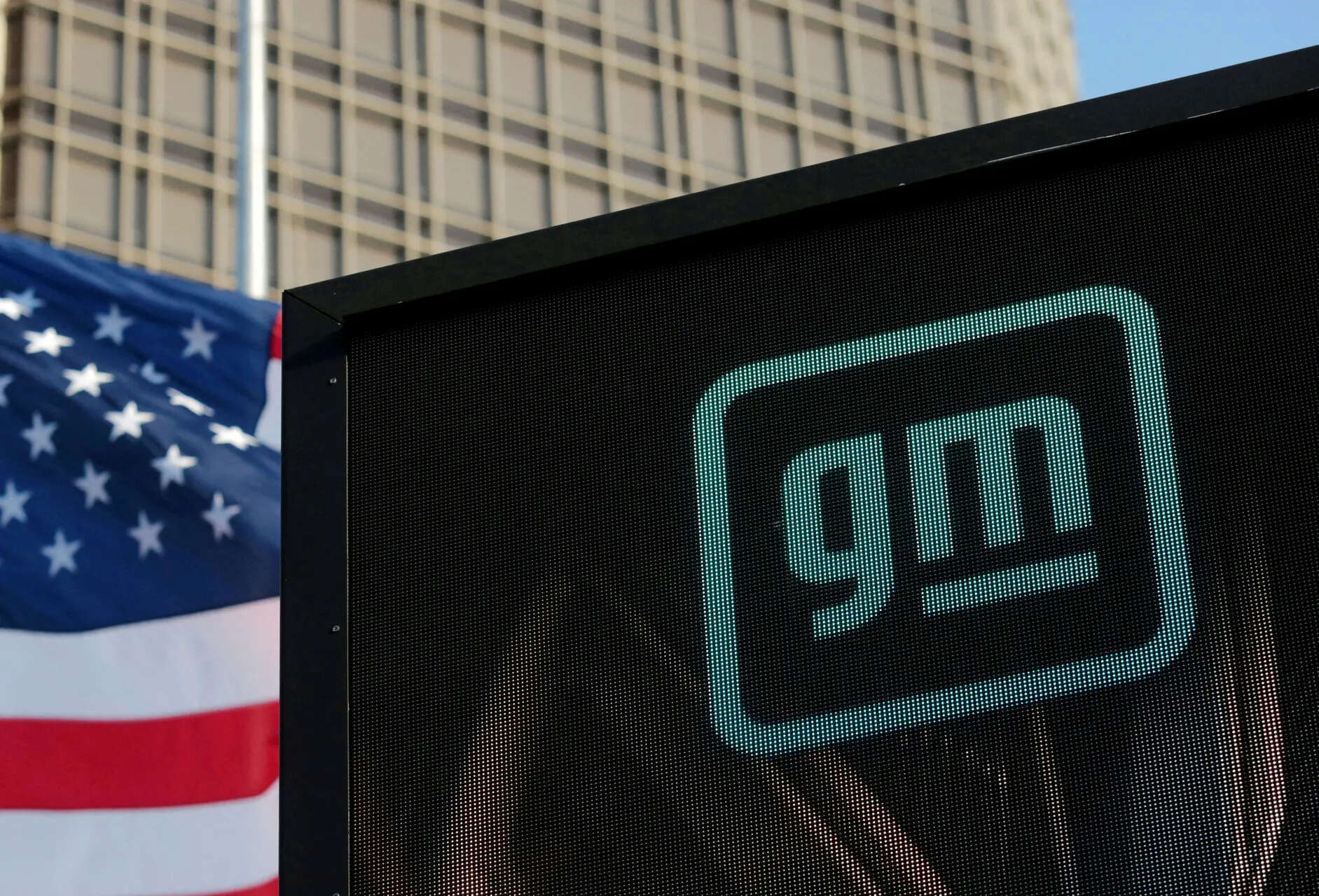 FILE PHOTO: The new GM logo is seen on the facade of the General Motors headquarters in Detroit, Michigan, U.S., March 16, 2021. Picture taken March 16, 2021. REUTERS/Rebecca Cook/File Photo