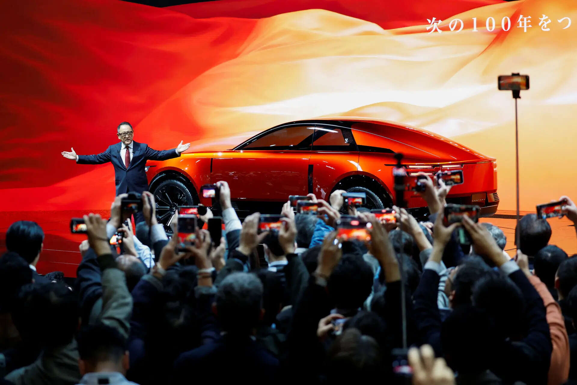 

<p>Toyota chairman Akio Toyoda speaks during a press day of the Japan Mobility Show 2025</p>
<p>“/><figcaption class=