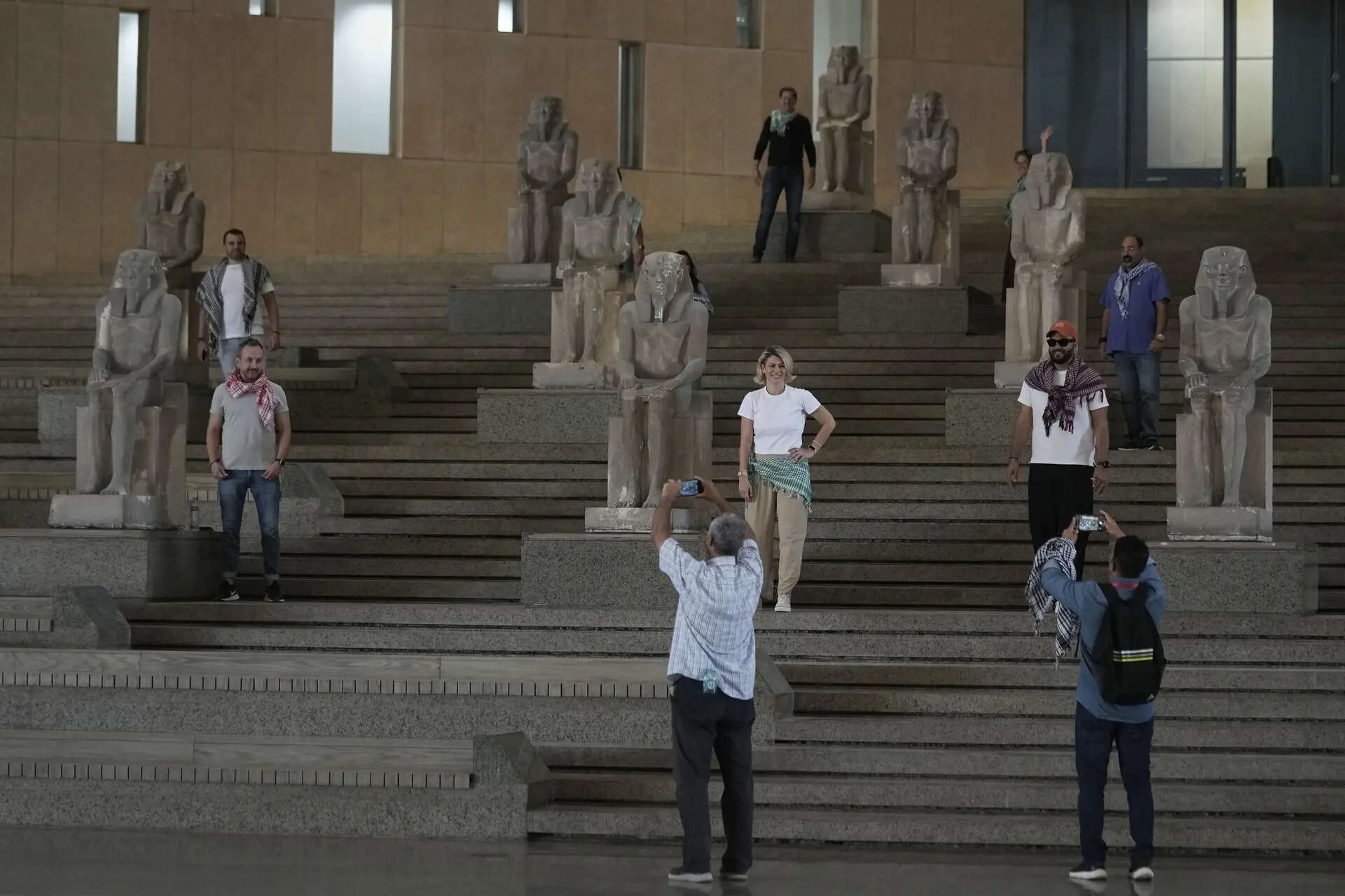 <p>Tourists pose at the Grand staircase at the Grand Egyptian Museum in Giza, Egypt, Friday, May 23, 2025. </p>