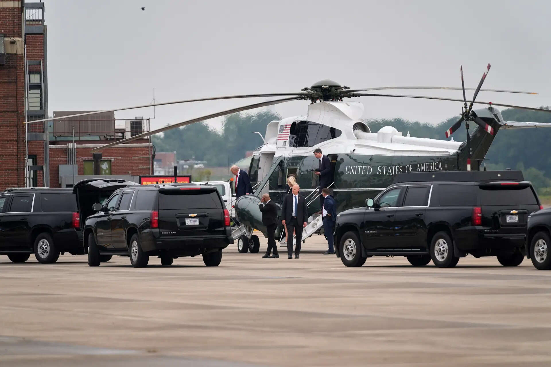 President Donald Trump walks off Marine One
