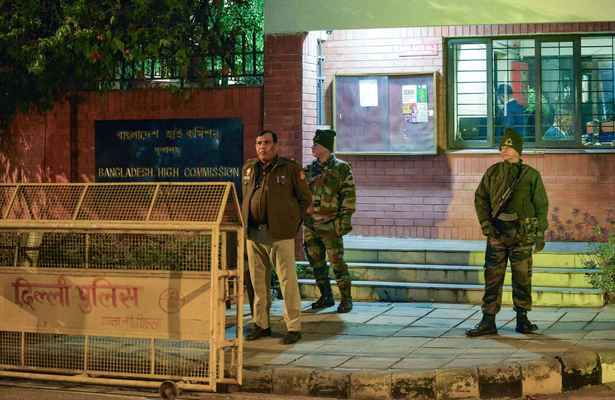 New Delhi, Dec 19 (ANI): Security officials stand guard outside the Bangladesh High Commission following violent protests in Bangladesh after the death of leader Sharif Osman Hadi, in New Delhi on Friday. (ANI Photo)