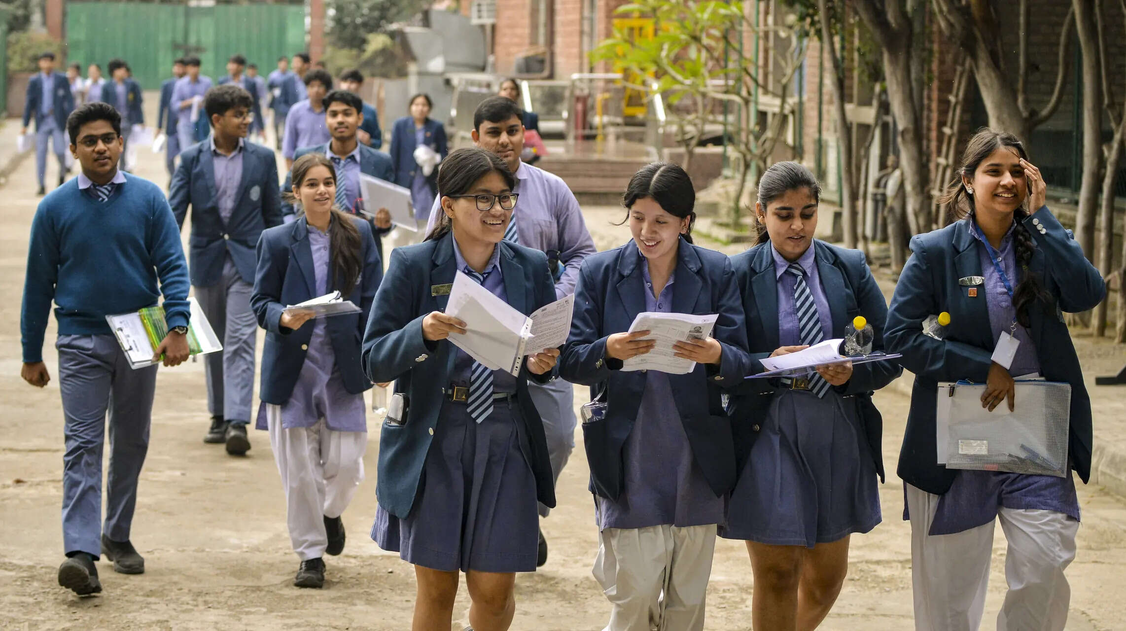 New Delhi: Students on their way back home after giving the Central Board of Secondary Education (CBSE) board exam, in New Delhi. (PTI Photo)
