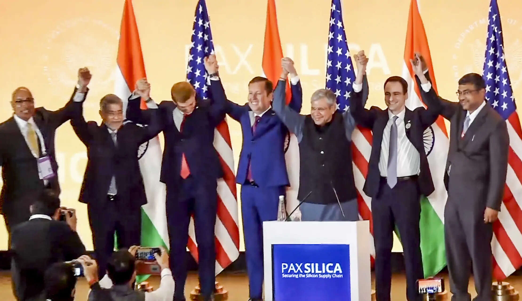 <p>Union Minister for Electronics and Information Technology Ashwini Vaishnaw, third right, US Ambassador to India Sergio Gor, centre, and others, join hands during an event announcing India joining the Pax Silica initiative, in New Delhi. </p>