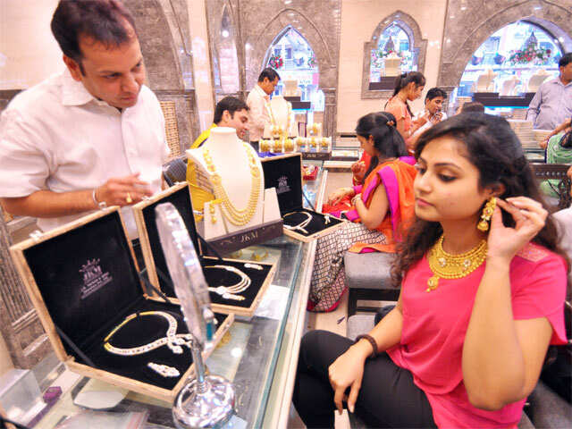 People buy gold jewellery on the occasion of Dhanteras from ajewellery shop in Jaipur on November 9, 2015.