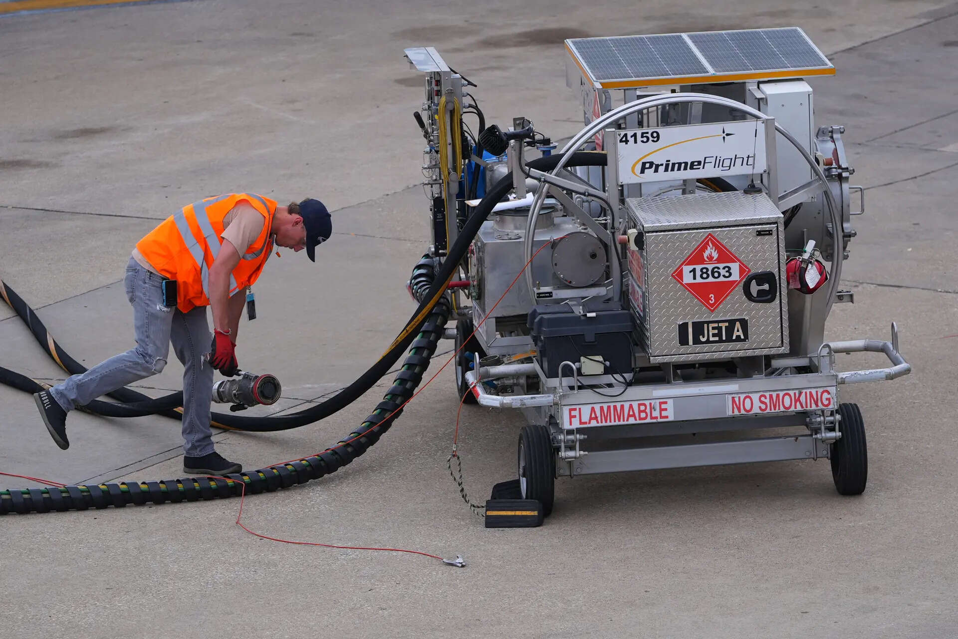 <p>FILE - A worker finishes up fueling a jet at DFW International Airport in Grapevine, Texas, April 14, 2026. (AP Photo/LM Otero, File)</p>