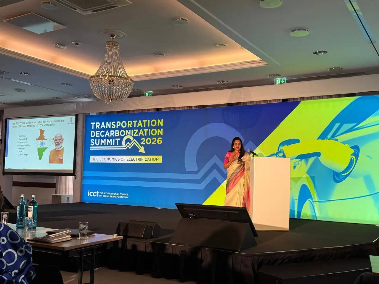 

<p>India’s EV penetration has risen to nearly 9 per cent in the 2025-26 fiscal year, driven by policy support, incentives and expanding infrastructure.</p>
<p>“><figcaption><span>India’s EV penetration has risen to nearly 9 per cent in the 2025-26 fiscal year, driven by policy support, incentives and expanding infrastructure.</span></figcaption></figure>
<p>India’s electric vehicle (EV) push is increasingly being shaped by energy security concerns, alongside climate goals, a senior government official said on Wednesday.</p>
<p>Speaking at a ‘Transportation Decarbonisation Summit’ in Berlin, Archana Mittal, programme director for electric mobility and infrastructure connectivity at NITI Aayog, said India views transport electrification as a way to reduce dependence on fossil fuel imports while supporting economic growth.</p>
<p>India has adopted a “whole-of-government” approach to accelerate EV adoption, combining national policies with state-level initiatives, manufacturing incentives and infrastructure expansion, she added.</p>
<p>India’s EV penetration has risen to nearly 9 per cent in the 2025-26 fiscal year, driven by policy support, incentives and expanding infrastructure, she said.</p>
<p>The government has rolled out schemes such as the Faster Adoption and Manufacturing of Electric Vehicles (FAME) programme and e-bus initiatives, alongside production-linked incentives to boost domestic manufacturing of vehicles, components and batteries, reduce import dependence and strengthen supply chains for critical minerals.</p>
<p>Charging infrastructure remains a key focus. The government recently approved about ₹1.27 billion ($15 million) to expand public EV charging in Delhi, targeting around 32,000 charging points by 2028.</p>
<p>Separately, Amit Bhatt of the International Council on Clean Transportation said EV sales in India rose 45 per cent year-on-year last month, underscoring accelerating demand in the fast-growing market.                    </p>
<div aria-label=