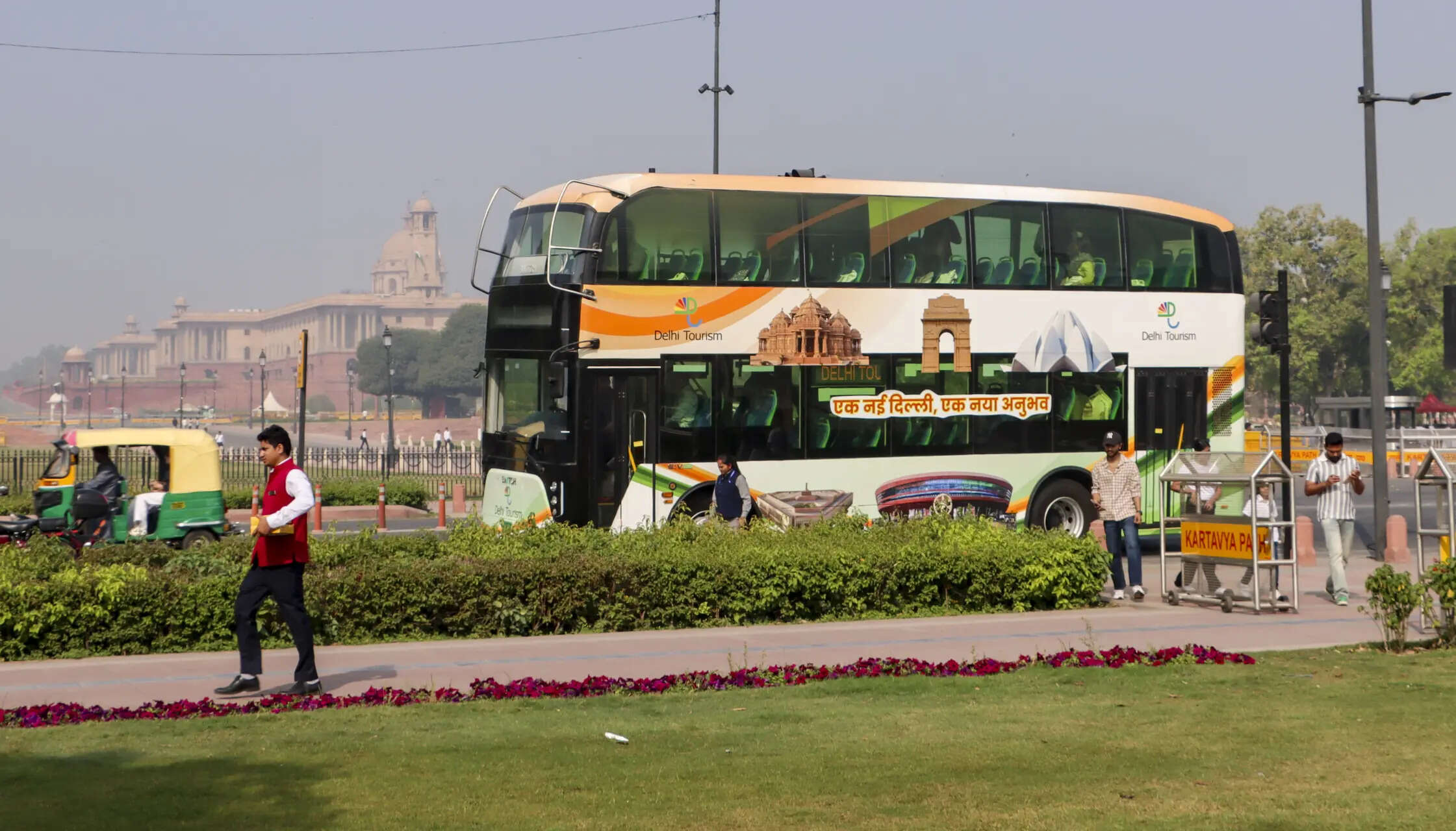 <p>Passengers aboard a double-decker bus during a tour of key landmarks in the capital, launched as part of an initiative by the Delhi Government to boost tourism, in New Delhi</p>