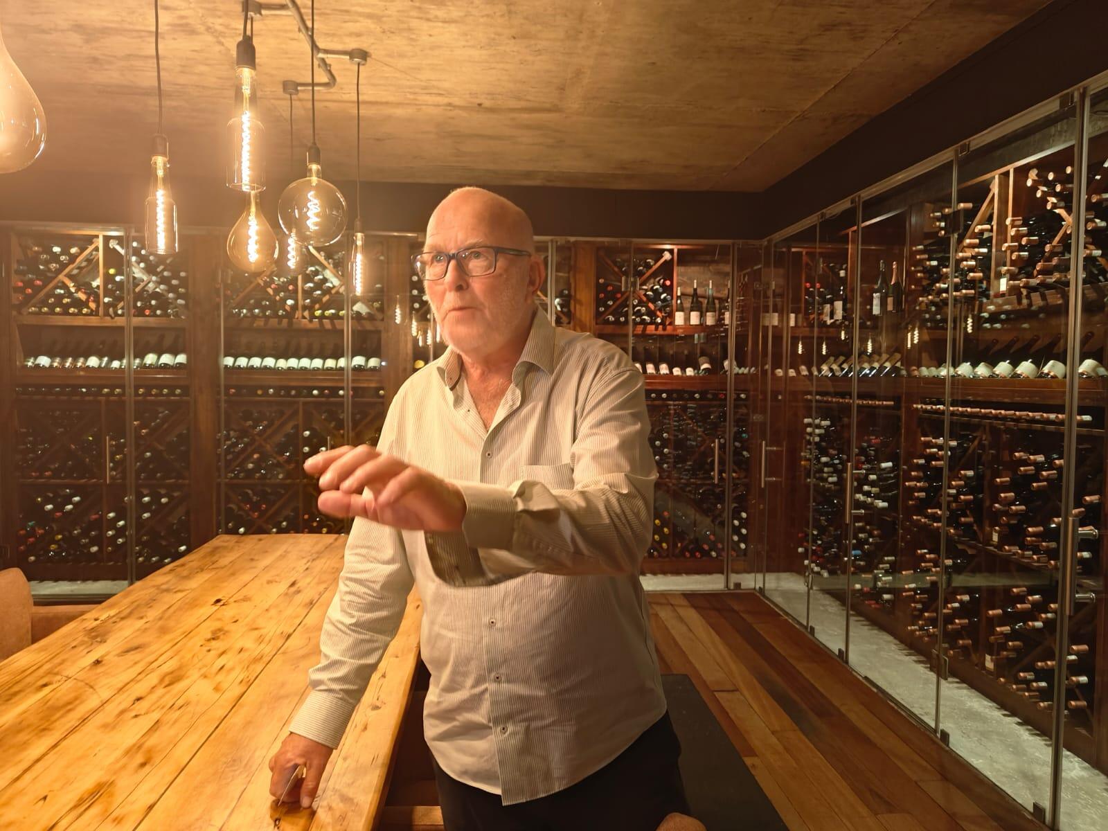 <p>Michael Lutzeyer in Grootbos's wine cellar.</p>