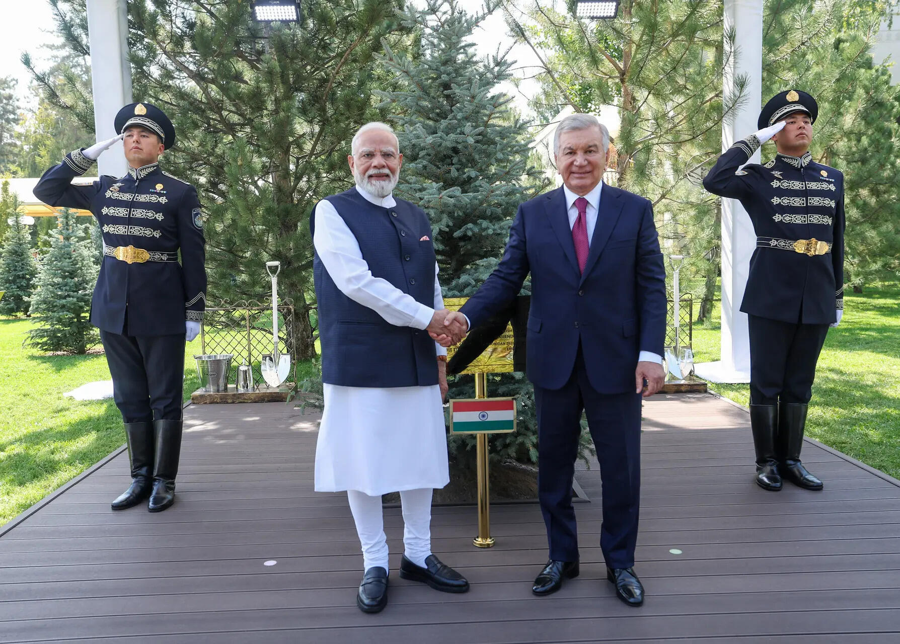 Prime Minister Narendra Modi and Uzbekistan President Shavkat Mirziyoyev shake hands after planting a tree at the Presidential Palace garden under the 'Ek Ped Maa Ke Naam' initiative of India and 'Yashil Makon' green efforts of Uzbekistan, in Tashkent on Sunday.