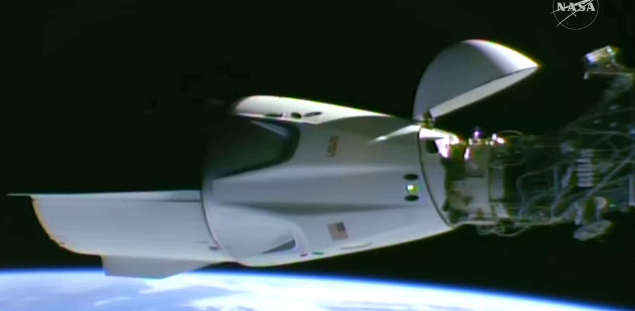 This image taken from video by NASA shows a SpaceX capsule carrying four astronauts docking at the International Space Station, Thursday, Oct. 1, 2026.