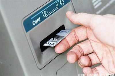 How do you withdraw money from an ATM?