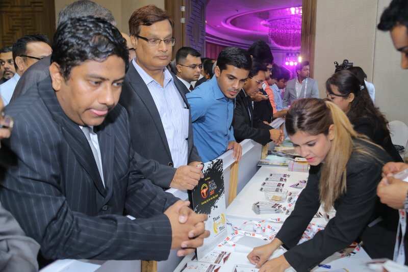 Delegates collecting their badgets from the counter