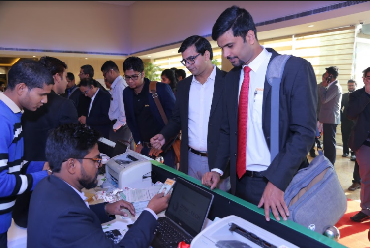 Delegates collecting their badgets from the counter