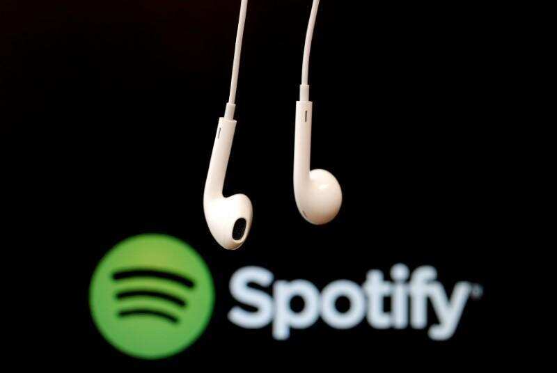 Spotify shares soar in $30 billion public listing debut