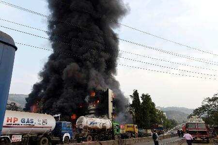 Fire fighters dousing fire that broke out in a factory at Turbhe MIDC, in navi mumbai on Sunday.Photo