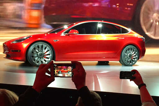 Tesla reports narrower than expected losses, shares swerve