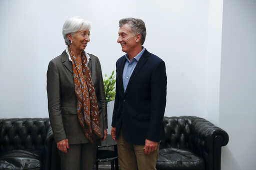 Argentina's President Mauricio Macri receives Christine Lagarde, the managing director of the IMF, at the presidential residence, in Buenos Aires, Argentina, Friday, March 16, 2018. (David Fernandez/Pool Photo via AP)