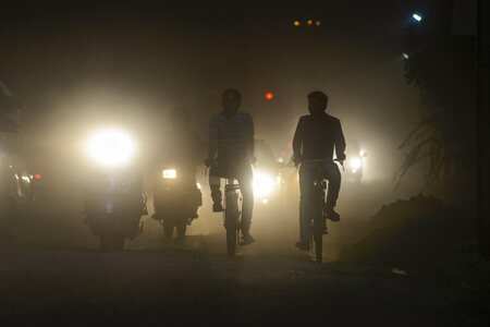 Cyclist ride on a dusty road amidst traffic, in Kanpur. The World Health Organization (WHO) in its pollution report ranked 14 Indian cities among world's 15 most polluted cities with Kanpur on top; capital city of New Delhi also features in the list.Photo